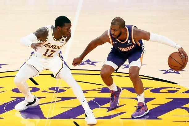 Kendrick Nunn of the Los Angeles Lakers plays defense on Chris Paul of the Phoenix Suns during a preseason game on October 10, 2021 at STAPLES Center...