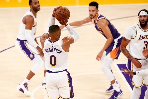 Russell Westbrook of the Los Angeles Lakers shoots a three point basket during a preseason game against the Phoenix Suns on October 10, 2021 at...