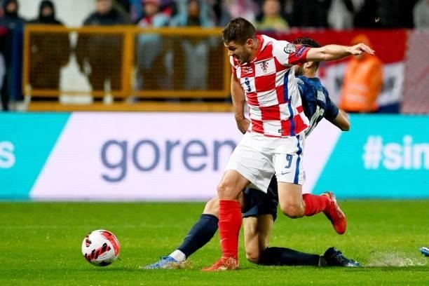 Croatia's midfielder Luka Ivanusec and midfielder Josip Stanisic fight for the ball with with Slovakia's defender David Hancko during the FIFA World...