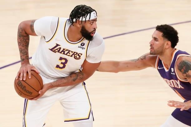Anthony Davis of the Los Angeles Lakers looks to pass the ball during a preseason game against the Phoenix Suns on October 10, 2021 at STAPLES Center...