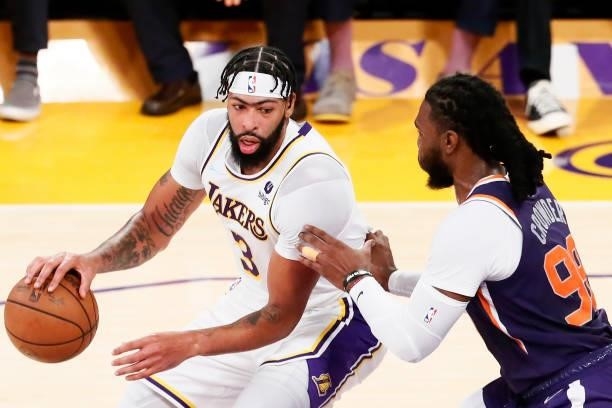 Jae Crowder of the Phoenix Suns plays defense on Anthony Davis of the Los Angeles Lakers during a preseason game on October 10, 2021 at STAPLES...