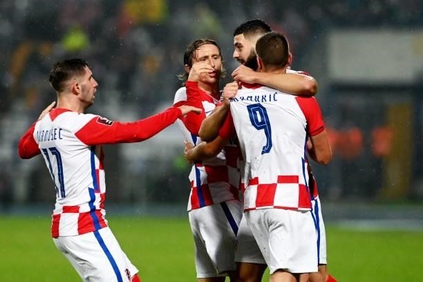 Croatia's players celebrate after scoring a goal during the FIFA World Cup Qatar 2022 qualification Group H football match between Croatia and...