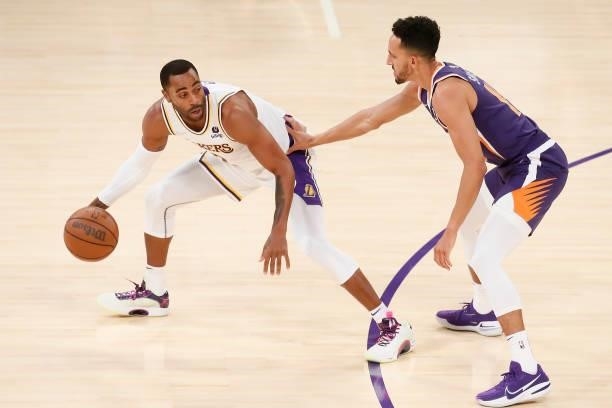 Landry Shamet of the Phoenix Suns plays defense on Wayne Ellington of the Los Angeles Lakers during a preseason game on October 10, 2021 at STAPLES...