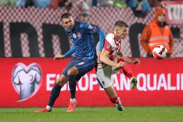Ivan Schranz of Slovakia and Borna Barisic of Croatia in action during the 2022 FIFA World Cup Group H Qualifier match between Croatia and Slovakia...
