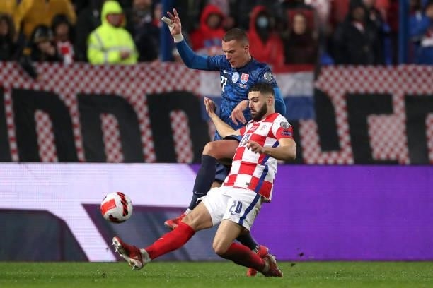Josko Gvardiol of Croatia and Ladislav Almasi of Slovakia in action during the 2022 FIFA World Cup Group H Qualifier match between Croatia and...