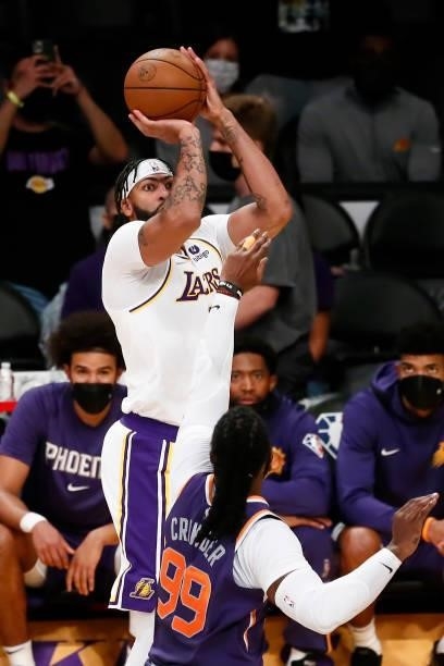 Anthony Davis of the Los Angeles Lakers shoots a three point basket during a preseason game against the Phoenix Suns on October 10, 2021 at STAPLES...