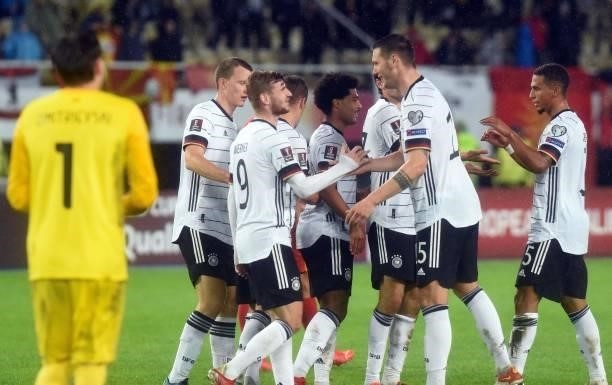 Germany's Timo Werner celebrates with teammates after scoring during the FIFA World Cup Qatar 2022 qualification Group J football match between North...