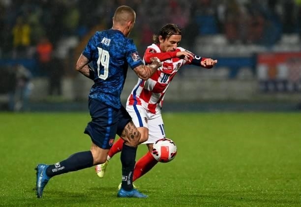 Croatia's midfielder Luka Modric vies with Slovakia's midfielder Juraj Hucka during the FIFA World Cup Qatar 2022 qualification Group H football...