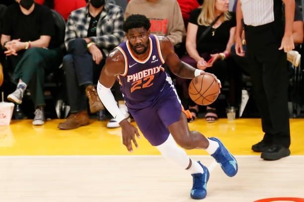 Deandre Ayton of the Phoenix Suns dribbles the ball during a preseason game against the Los Angeles Lakers on October 10, 2021 at STAPLES Center in...