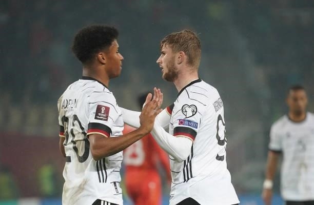 Timo Werner of Germany celebrates after scoring his team's third goal with teammates during the 2022 FIFA World Cup Qualifier match between North...