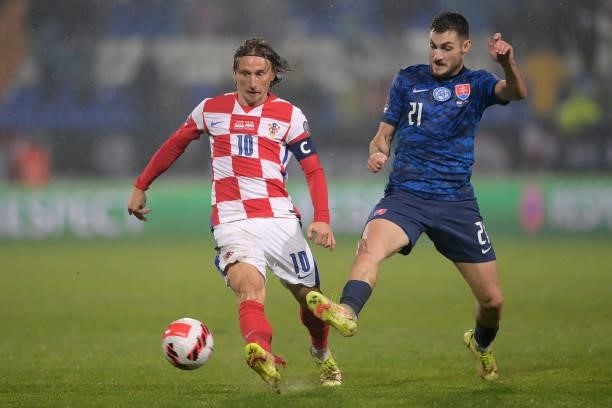 Luka Modric of Croatia and Matus Bero of Slovakia in action during the 2022 FIFA World Cup Group H Qualifier match between Croatia and Slovakia at...