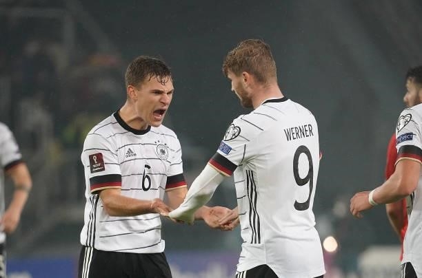 Timo Werner of Germany celebrates after scoring his team's third goal with Joshua Kimmich of Germany during the 2022 FIFA World Cup Qualifier match...