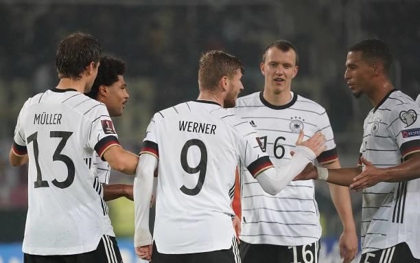 Timo Werner of Germany celebrates after scoring his team's third goal with teammates during the 2022 FIFA World Cup Qualifier match between North...