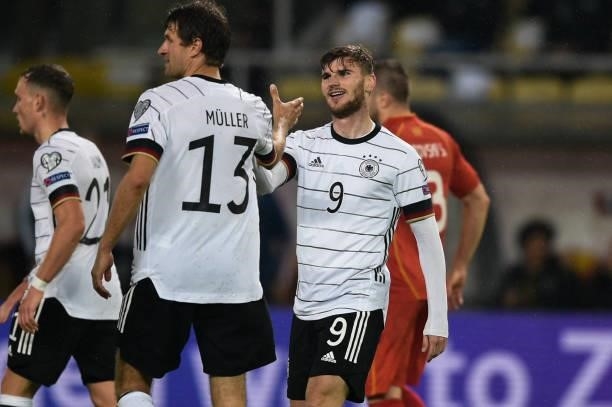 Germany's forward Timo Werner celebrates after scoring his team's third goal with Germany's forward Thomas Mueller during the FIFA World Cup Qatar...