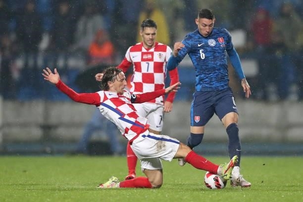 Luka Modric of Croatia and Erik Jirka of Slovakia in action during the 2022 FIFA World Cup Group H Qualifier match between Croatia and Slovakia at...
