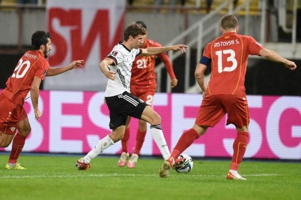 Germany's forward Thomas Mueller fights for the ball with North Macedonia's defender Stefan Ristovskiki during the FIFA World Cup Qatar 2022...