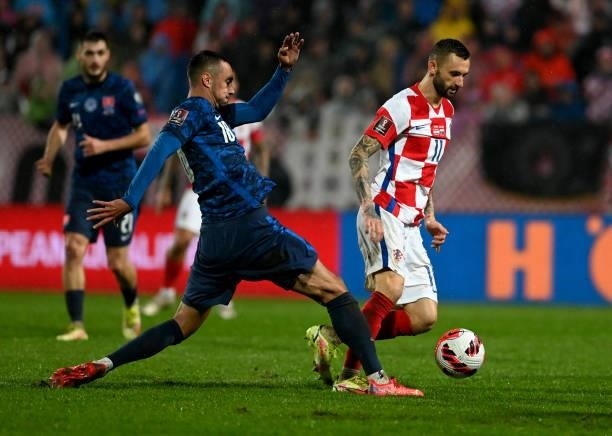 Croatia's midfielder Marcelo Brozovic fights for the ball with Slovakia's midfielder Ivan Schranz during the FIFA World Cup Qatar 2022 qualification...