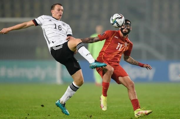 Germany's defender Lukas Klostermann vies with North Macedonia's midfielder Darko Churlinov during the FIFA World Cup Qatar 2022 qualification Group...
