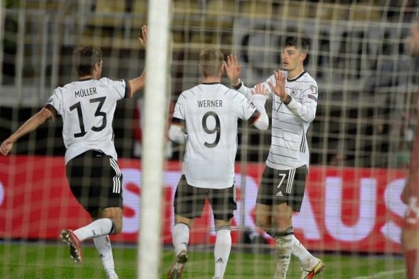 Germany's midfielder Kai Havertz celebrates scoring his team's first goal with teammates Germany's forward Timo Werner and Germany's forward Thomas...