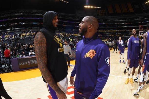Carmelo Anthony of the Los Angeles Lakers and Chris Paul of the Phoenix Suns embrace after a preseason game on October 10, 2021 at STAPLES Center in...