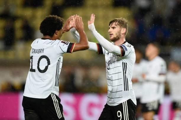 Germany's forward Timo Werner celebrates after scoring his team's second goal with Germany's midfielder Serge Gnabry during the FIFA World Cup Qatar...