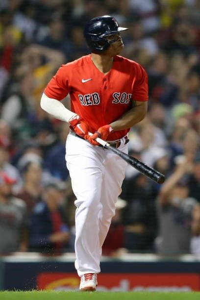 Rafael Devers of the Boston Red Sox reacts after hitting a three run home run in the bottom of the third inning during Game 4 of the ALDS between the...