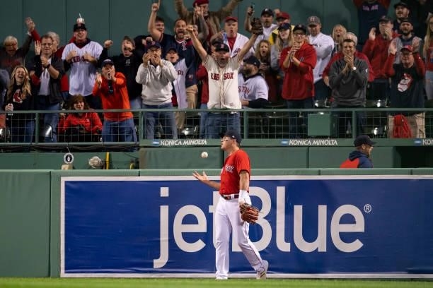 Hunter Renfroe of the Boston Red Sox reacts after catching a line drive during the first inning of game four of the 2021 American League Division...