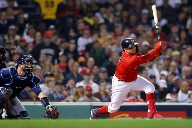 Christian Vázquez of the Boston Red Sox hits a single in the bottom of the third inning during Game 4 of the ALDS between the Tampa Bay Rays and the...