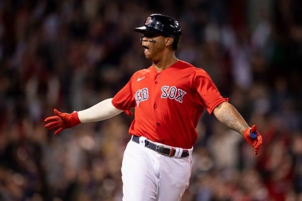 Rafael Devers of the Boston Red Sox reacts after hitting a three run home run during the third inning of game four of the 2021 American League...