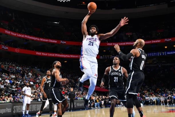 Joel Embiid of the Philadelphia 76ers dunks the ball against the Brooklyn Nets during a preseason game on October 11, 2021 at Wells Fargo Center in...