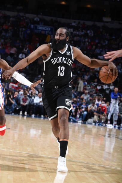 James Harden of the Brooklyn Nets passes the ball against the Philadelphia 76ers during a preseason game on October 11, 2021 at Wells Fargo Center in...