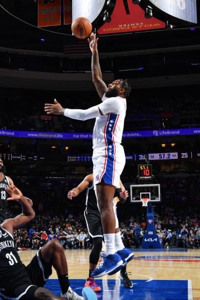Andre Drummond of the Philadelphia 76ers shoots the ball against the Brooklyn Nets during a preseason game on October 11, 2021 at Wells Fargo Center...