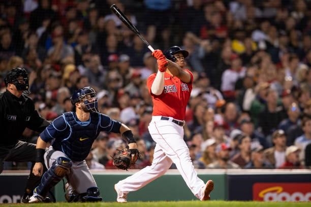Rafael Devers of the Boston Red Sox hits a three run home run during the third inning of game four of the 2021 American League Division Series...