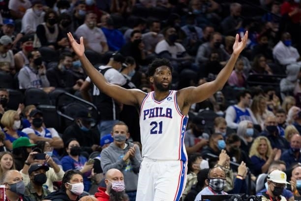 Joel Embiid of the Philadelphia 76ers reacts against the Brooklyn Nets in the first half at the Wells Fargo Center on October 11, 2021 in...