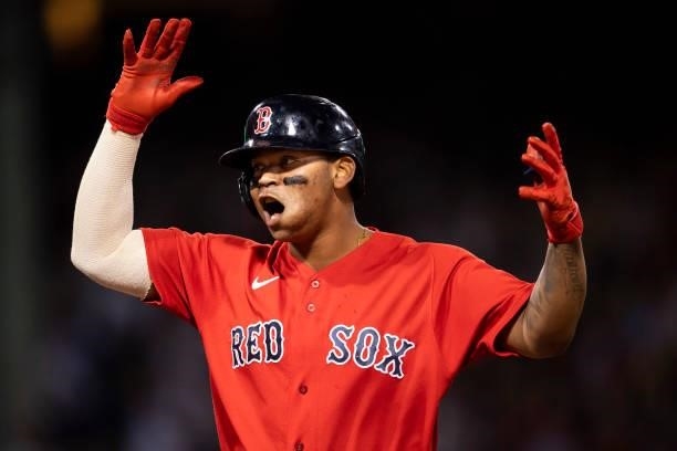 Rafael Devers of the Boston Red Sox reacts after hitting a single during the seventh inning of game four of the 2021 American League Division Series...