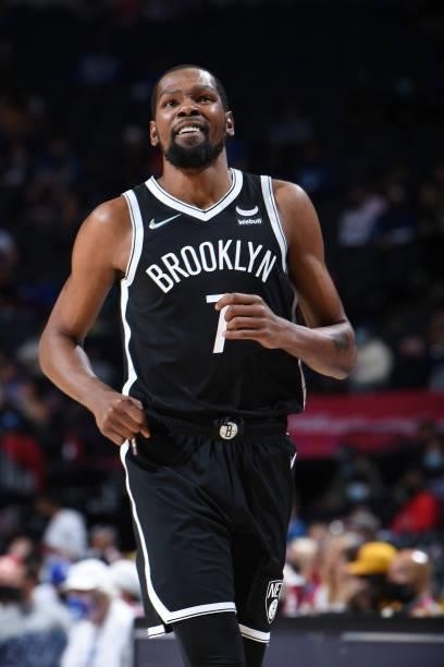 Kevin Durant of the Brooklyn Nets looks on during a preseason game on October 11, 2021 at Wells Fargo Center in Philadelphia, Pennsylvania. NOTE TO...