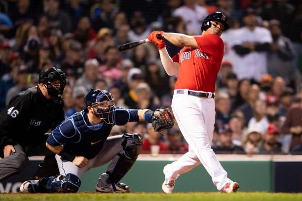 Rafael Devers of the Boston Red Sox hits a single during the seventh inning of game four of the 2021 American League Division Series against the...