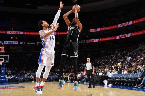 Kevin Durant of the Brooklyn Nets shoots the ball against Danny Green of the Philadelphia 76ers during a preseason game on October 11, 2021 at Wells...