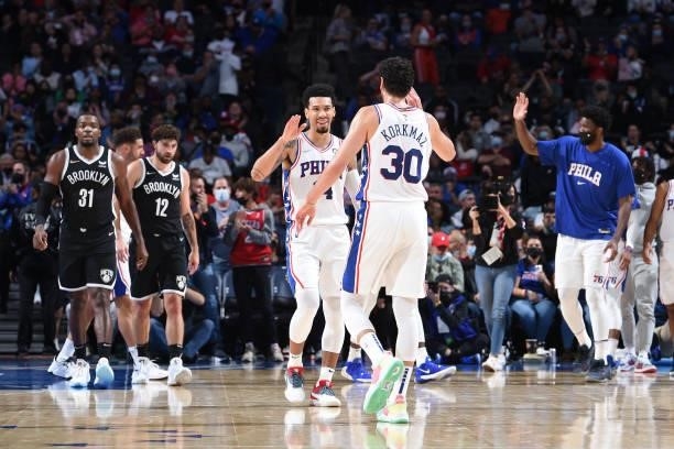 Danny Green of the Philadelphia 76ers and Furkan Korkmaz of the Philadelphia 76ers high-five during a preseason game on October 11, 2021 at Wells...