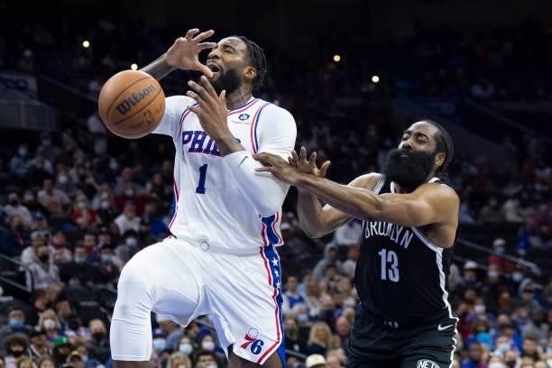Andre Drummond of the Philadelphia 76ers drives to the basket and is fouled by James Harden of the Brooklyn Nets in the first half at the Wells Fargo...