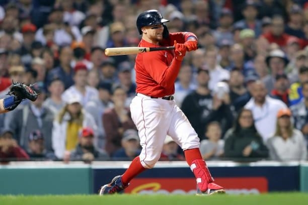 Christian Vázquez of the Boston Red Sox hits a single in the bottom of the ninth inning during Game 4 of the ALDS between the Tampa Bay Rays and the...