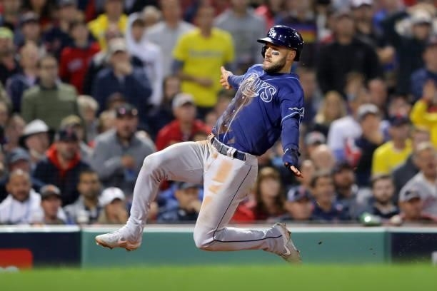 Kevin Kiermaier of the Tampa Bay Rays slides safely into home in the top of the eighth of inning during Game 4 of the ALDS between the Tampa Bay Rays...