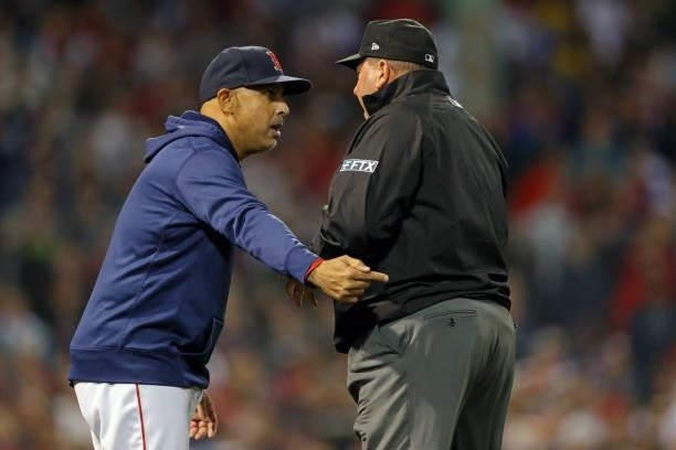 Alex Cora of the Boston Red Sox speaks to an umpire in the ninth inning during Game 4 of the ALDS between the Tampa Bay Rays and the Boston Red Sox...