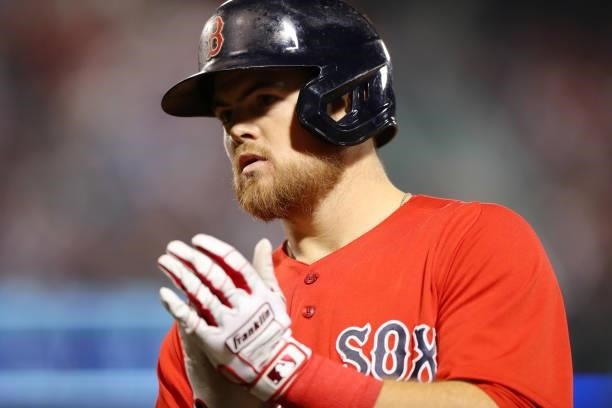 Christian Arroyo of the Boston Red Sox reacts after hitting a sacrifice bunt in the bottom of the ninth inning during Game 4 of the ALDS between the...
