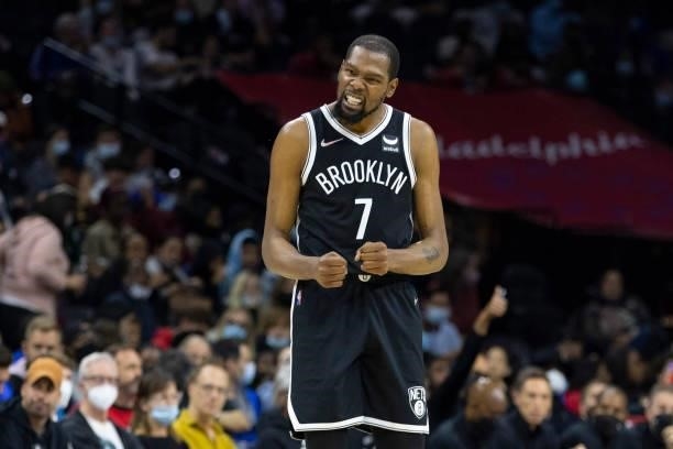 Kevin Durant of the Brooklyn Nets reacts against the Philadelphia 76ers in the second half at the Wells Fargo Center on October 11, 2021 in...