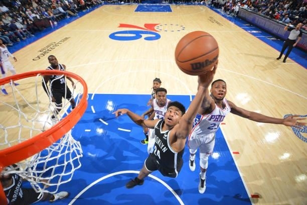 Cam Thomas of the Brooklyn Nets grabs the rebound against the Philadelphia 76ers during a preseason game on October 11, 2021 at Wells Fargo Center in...