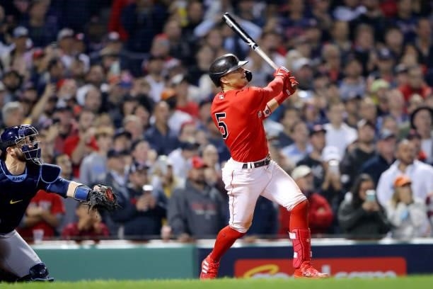 Enrique Hernández of the Boston Red Sox hits the game winning sacrifice fly in the bottom of the ninth inning as the Red Sox defeat the Tampa Bay...