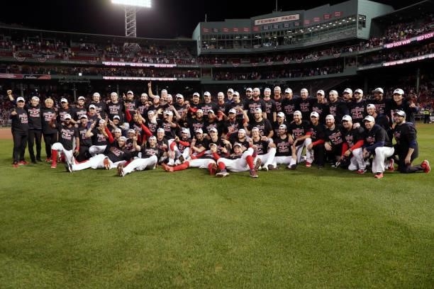 Members of the Boston Red Sox celebrate after defeating the Tampa Bay Rays 6-5 in Game 4 of the ALDS at Fenway Park on Monday, October 11, 2021 in...