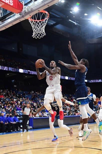Eric Bledsoe of the LA Clippers drives to the basket during a preseason game against the Minnesota Timberwolves on October 11, 2021 at Toyota Arena...