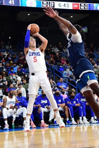 Luke Kennard of the LA Clippers shoots a three point basket during a preseason game against the Minnesota Timberwolves on October 11, 2021 at Toyota...